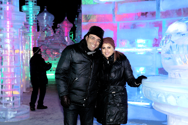 Ambassador and Mrs. Ramzi of Azerbaijan pose for the camera inside a decorated ice house.