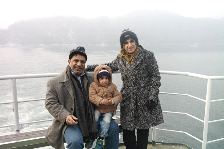 Ambassador and Mrs. Mohammed Salim Alhathy of Oman pose for the camera with their daughter.