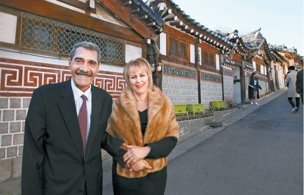Ambassador Mohammed El Amine Derragui of the People’s Democratic  of Algeria in Seoul posing for the camera in front of traditional Korean houses at the Hanok Maul Village in Seoul.