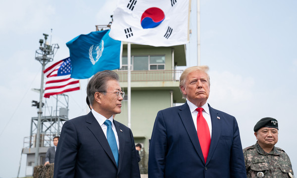 President Moon Jae-in and U.S. President Donald Trump are shown here on June 30 visiting an observation post in the Demilitarized Zone separating the two Koreas. The U.S. State Department on July 2 said both leaders reaffirmed the "ironclad" alliance of their two countries. (White House)