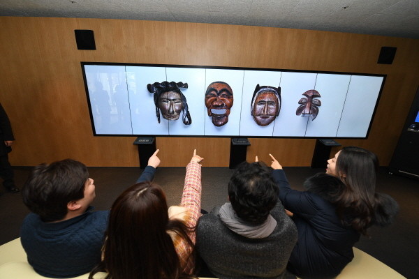 Visitors exploring the digital content of the cultural heritage at the National Palace Museum in Sejong-ro, Seoul.
