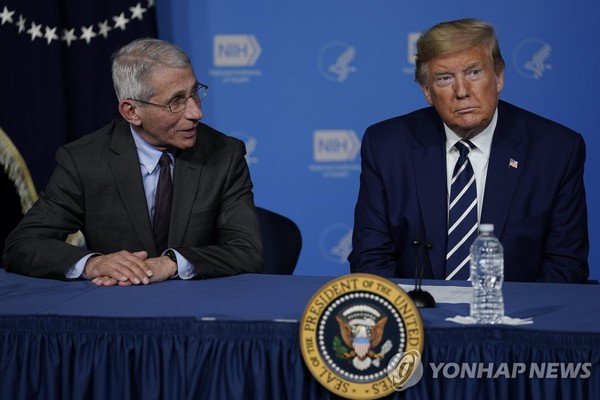U.S. President Donald Trump (R) at the National Institutes of Health in Bethesda, Maryland, on March 3, 2020.