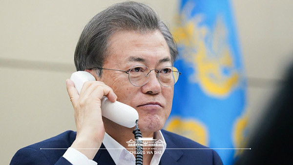 Photo shows President Moon Jae-in Speaks by Phone to French President Macron.