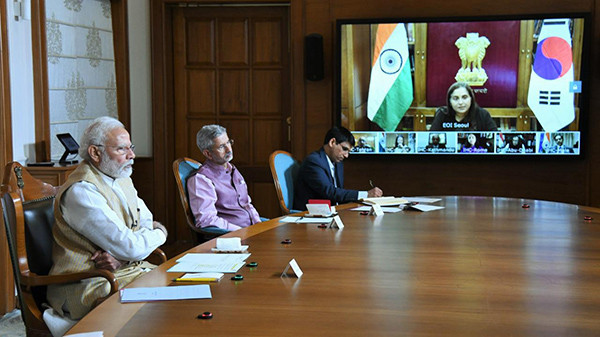 Prime Minister Shri Narendra Modi (left) speaks at the video conference.