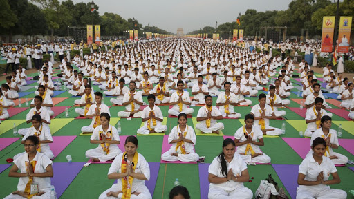 A group of women practicing Yoga in India.