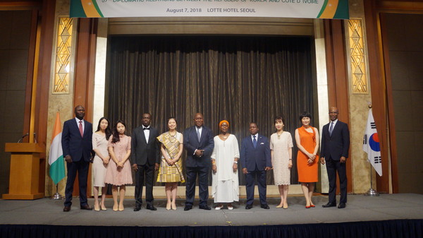 7. Ambassador Kouassi Bile of Cote d’Ivoire (6th from left) poses with the staff members of his embassy.