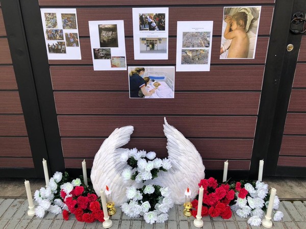 Condolence flowers and pictures of the victims from Armenian attacks placed in front of the Azerbaijan Embassy in Seoul