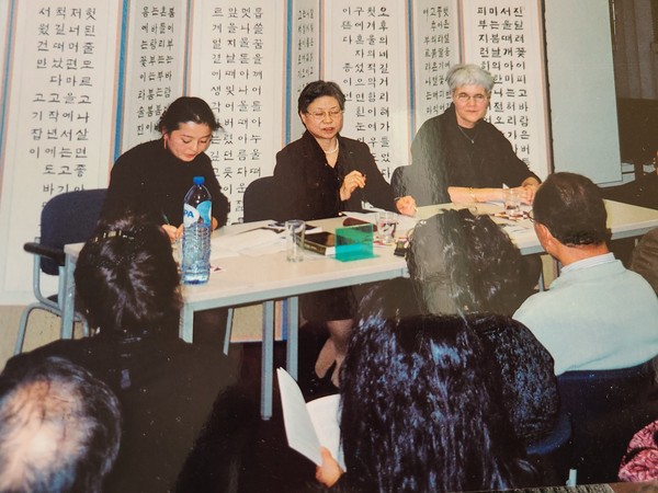 Novelist Han (center) attends a reading event for her novels at the Korean Cultural Center in Berlin, Germany in November 2004.