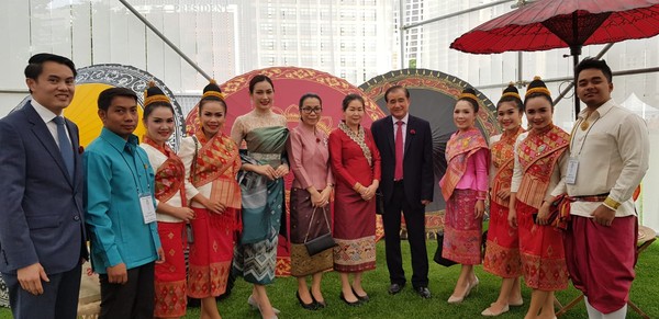 Ambassador Boupha of Laos (eighth from left) poses with young ladies and gentlemen of Laos in their traditional costumes.