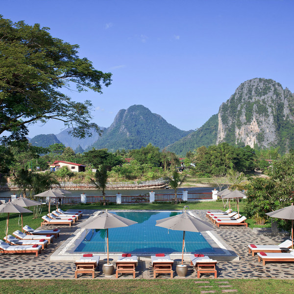 One of the rest and recuperation centers complete with a swimming pool and scenic high mountains in the backdrop in Vangvieng District.