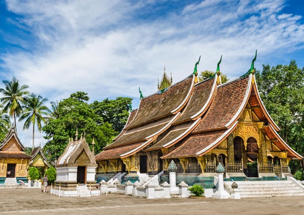 An ancient Lao architecture, a unique symbol of Buddhist architectural wonders with pointed roof ends named Wat Xiengthong (Xiengthong Temple), Luangprabang City.