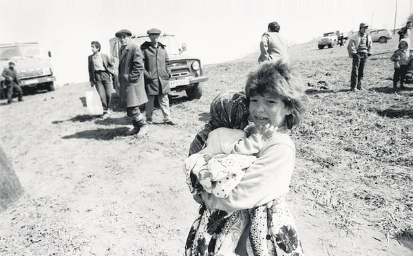 Azerbaijani girl holding her sister after fleeing the massacre by Armenia in the town of Khojaly, February 1992.
