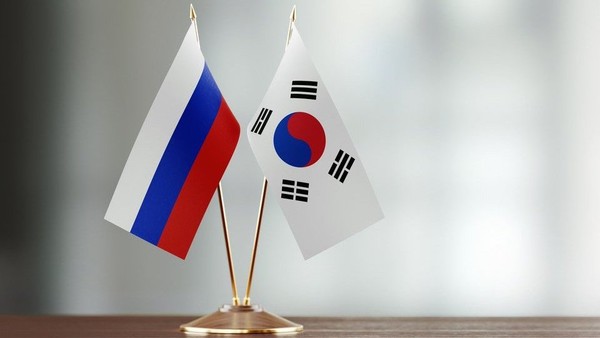 ​Russian and Korean flags​