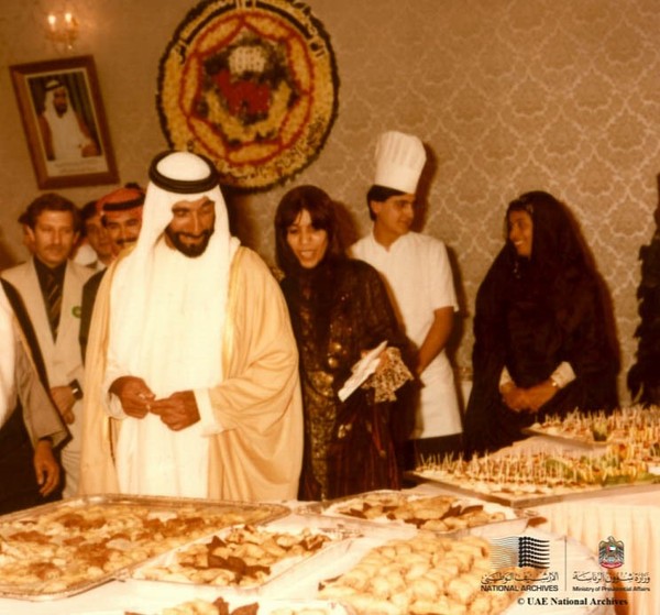 UAE Crown Prince Mohamed bin Zayed Al Nahyan looks around traditional foods.