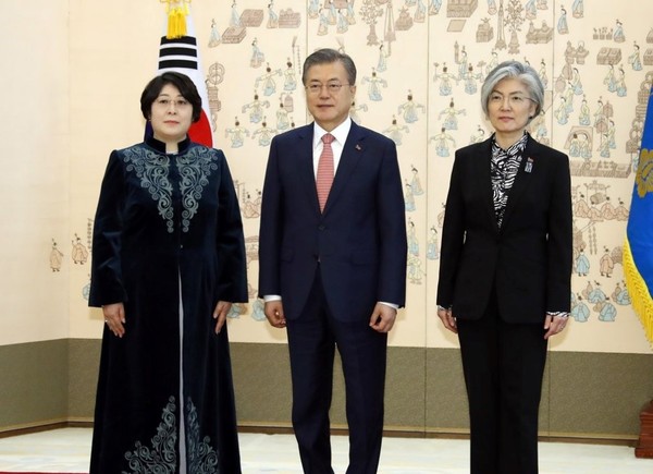 President Moon Jae-in is flanked on the right by the then Minister of Foreign Affairs Kang Kyung-wha and just-arrived Ambassador Dinara Kemelova of the Kyrgyz Republic at the Presidential Mansion of Chong Wa Dae in Seoul on March 8, 2019.