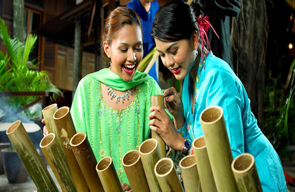 Young ladies enjoy Hari Raya Puasa, the day of celebration.