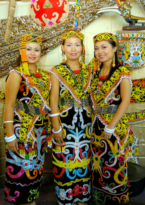 Young ladies of the Iban tribe clad in traditional clothes