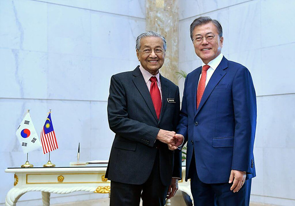 President Moon Jae-in of South Korea (right) shaking hands with Prime Minister Tun Dr Mahathir Mohamad (left) of Malaysia at Perdana Putra on March 13, 2019.