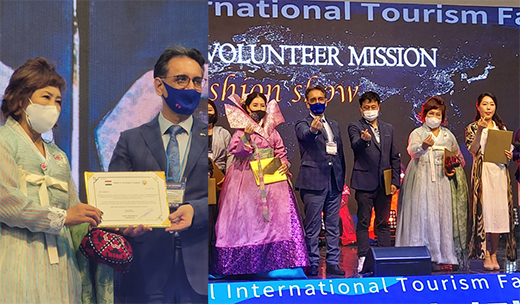 Ambassador Yusuf-Sharifzoda of Tajikistan in Seoul (second from left, foreground) presents a plaque of appreciation to Chairperson Jin Hyang-ja (left).