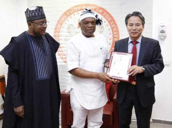 Senate Chief Whip Dr. Orji Kalu is flanked on the left by Senator Lawall Anka and Ambassador Kim Young-chae of Korea in Nigeria on the right.