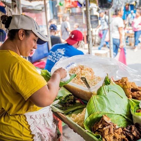 Nicaragua has a strong agricultural industry and many popular foods are made using beans, grains, beef and pork. The photo shows gallo pinto, a fried dish of rice and beans, and vigorón, a salad of steamed cassava, pork and marinated cabbage served atop a banana leaf.