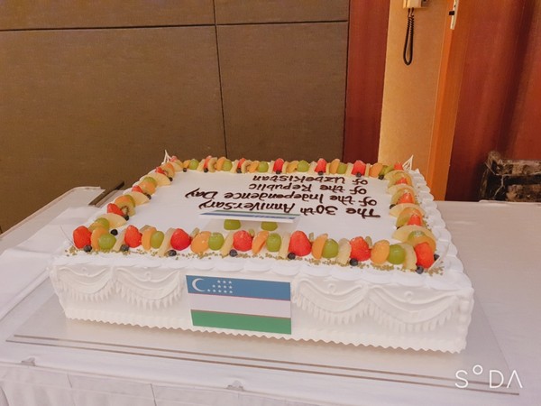 An impressive celebration cake at the reception venue attracted the attention of the guests.