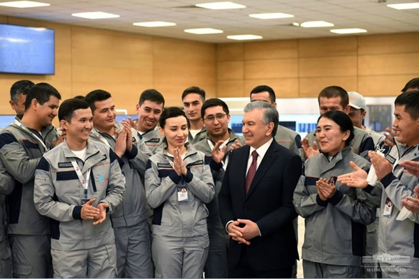 President of Uzbekistan Shavkat Mirziyoyev with workers Uzbekistan GTL