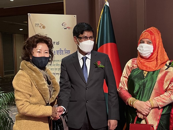 Ambassador Hossain of Bangladesh is flanked on the left by Vice Chairperson Joy Cho of The Korea Post and Mrs. Hossain on the right.
