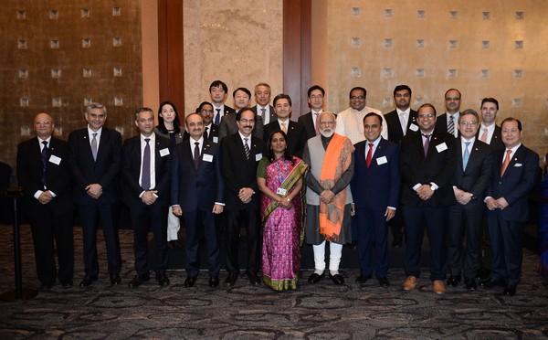 Prime Minister Narendra Modi and Ambassador Ambassador Sripriya Ranganathan of India in Seoul (fifth and sixth from right, front row, respectively) pose with the board members of the Indian Chamber of Commerce in Seoul.