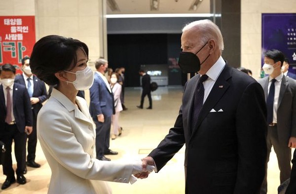 Visiting President Joe Biden of the United States (right, foreground) is greeted by First Lady Kim Kun-hee at the National Museum of Korea in Yongsan (former South Post of the U.S. Forces Command in Seoul).