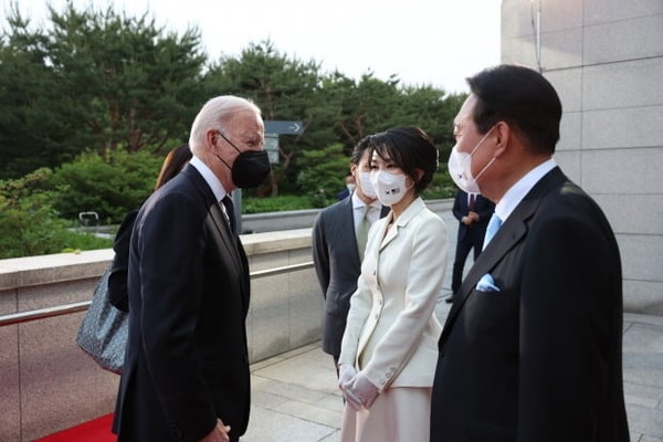 U.S. President Joe Biden greets First Lady Kim Gun-hee before entering the welcoming dinner at the National Museum of Korea in Yongsan-gu, Seoul, on May 21.
