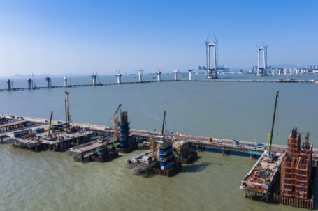 The Shenzhen–Zhongshan Bridge to the south of Wangqingsha township, Nansha district, Guangzhou is under construction, April 3, 2022. It is another super structure after the Hong Kong-Zhuhai-Macao Bridge, and is expected to open to traffic in 2024. (Photo by Wei Jinsong/People's Daily Online)