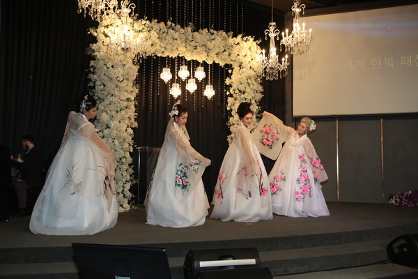 A traditional Hanbok fashion show gets underway where a variety of Korean Hanbok costumes were displayed at the Riverside Hotel south of the Han River on April 15, 2022.