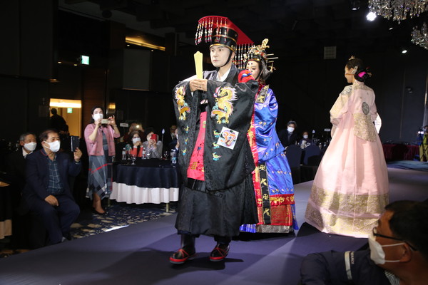 A male model in traditional clothes participates in the fashion show held at the Riverside Hotel south of the Han River on April 15, 2022.