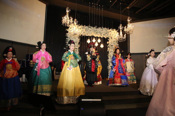 Female models in traditional Hanbok parade in the fashion show.