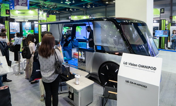 Visitors to NextRise Seoul 2022 look around the vehicle displayed at the COEX in Seoul on June 16.
