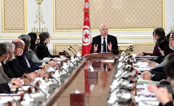 President Kais Saied  of Tunisia (center) presides over the weekly cabinet meeting in Carthage Palace in Tunis, Tunisia on Dec. 2, 2021.
