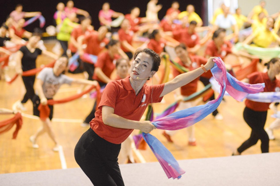 People practice dancing on a square dancing training course held in a stadium in Huai'an, east China's Jiangsu province, July 14, 2021. (Photo by People’s Daily Online)
