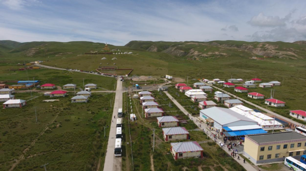 Photo taken on Aug. 11, 2020 shows a Tibetan village in Daotanghe township, Gonghe county, Hainan Tibetan autonomous prefecture, northwest China's Qinghai province. (Photo by Meng Zhongde/People's Daily Online)