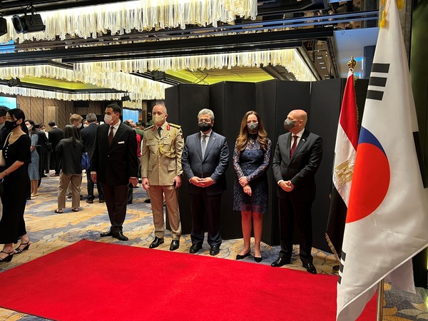 Ambassador and Mrs. Rahman of the Egypt (right and second from right) greet incoming VIP guests at the entrance of the reception venue at the Four Seasons Hotel in Seoul on July 22, 2022.