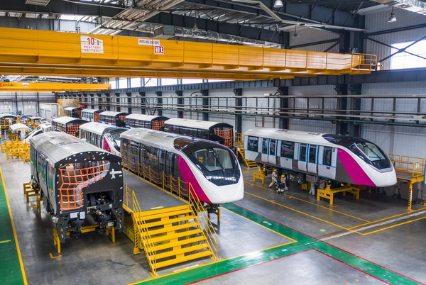 Single track trains to be exported to Thailand are assembled in a workshop in Wuhu Economic and Technological Development Zone, east China's Anhui province, July 21, 2022. (Photo by Xiao Benxiang/People's Daily Online)