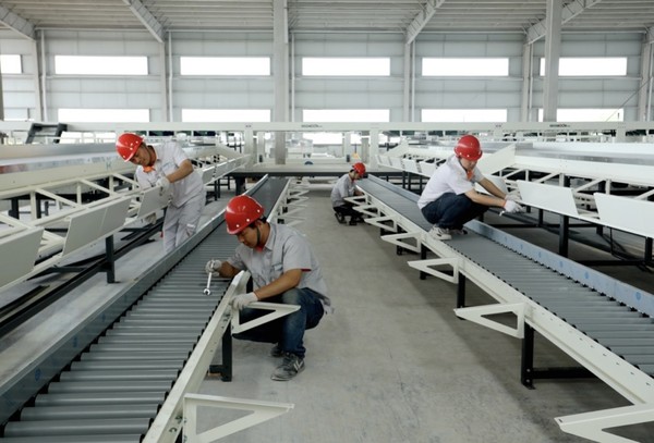 An intelligent cold-chain logistics center is under construction in Fujia township, Renshou county, Meishan, southwest China's Sichuan province, April 12, 2022. (Photo by Pan Shuai/People's Daily Online)