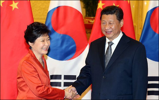 President Park Geun-hye of Korea and President Xi Jinping of China shake hands with each other during Korea-China Summit at the Great Hall of the People in Beijing in 2014.