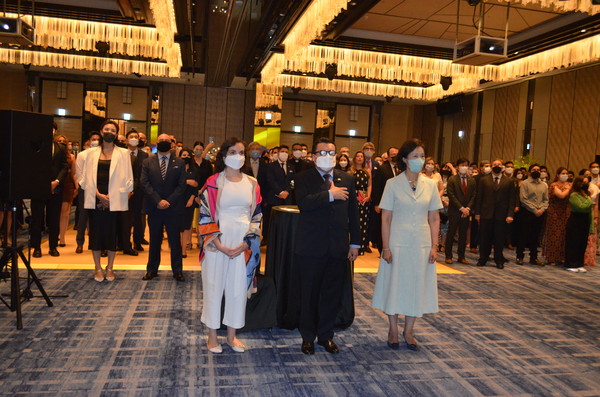 Ambassador and Juan Carlos Caiza Rosero of Colombia (center and left, foreground) stand at attention with Deputy Minister Hyoeun Jenny Kim of Foreign Affairs of Korea (right) while the national anthems of Korea and Colombia were presented.
