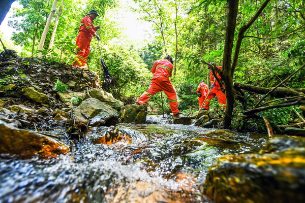 Forest rangers go on a patrol mission in a state-owned forest farm in Baitu township, Fengcheng, east China's Jiangxi province, April 21, 2022. (Photo by Zhou Liang/People's Daily Online)