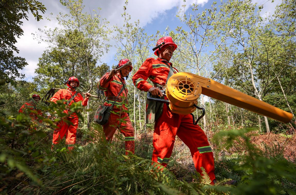 Forest rangers of a state-owned forest farm in Bijie, southwest China's Guizhou province go on a patrol mission for fire prevention, Aug. 24, 2022. (Photo by Chen Xi/People's Daily Online)