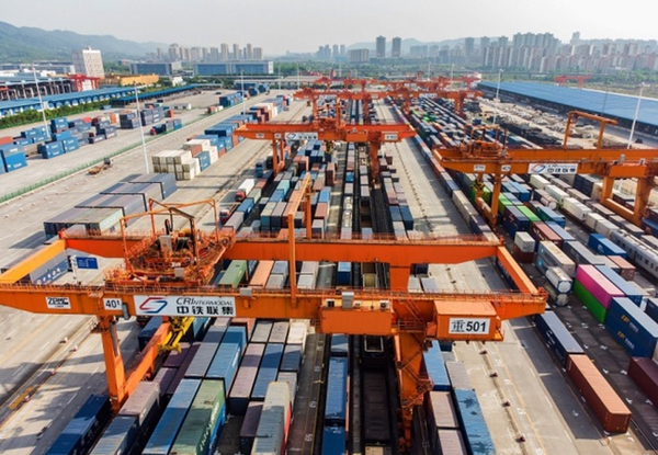 Containers are handled at a railway logistics center in Chongqing International Logistics Hub Park in Shapingba district, southwest China's Chongqing municipality, April 2022. (Photo by Sun Kaifang/People's Daily) 