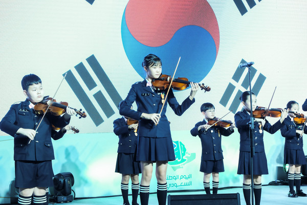Children’s violin performance at the Saudi Arabia National Day reception.