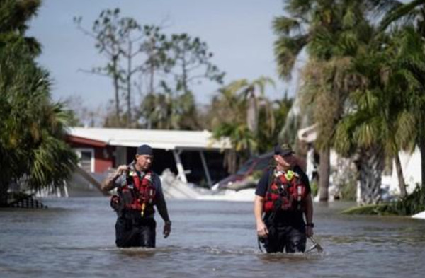 U.S. rescuers are searching for survivors on Sept. 29 in a residential area in Fort Myers, Florida, where Hurricane Ian swept through.