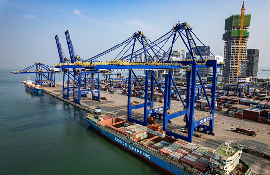Containers are being handled at a terminal in Haikou, south China's Hainan province, September, 2022. China's foreign trade volume increased 10.1 percent year on year to 27.3 trillion yuan in the first eight months of this year. (Photo by Su Bikun/People's Daily Online) 